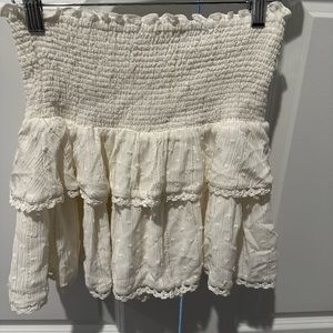 Cream skater skirt with gold threading and detail.